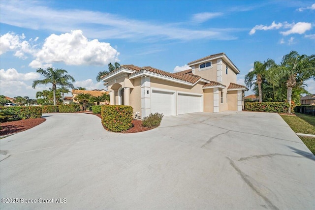 mediterranean / spanish-style house featuring a garage