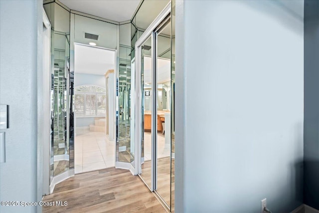 interior space featuring wood finished floors and visible vents