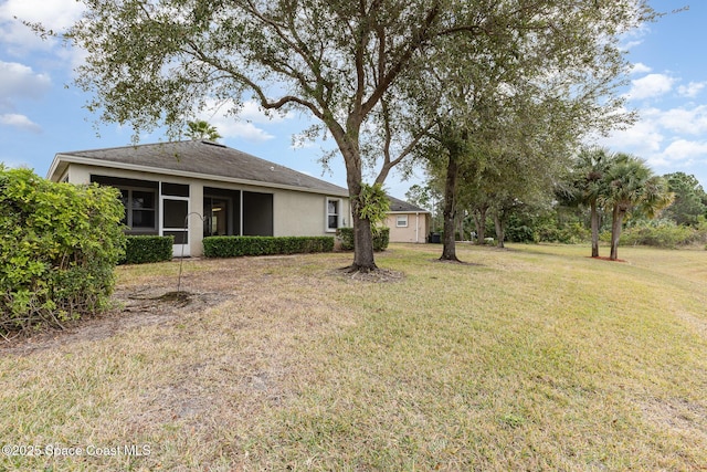 view of yard with a sunroom