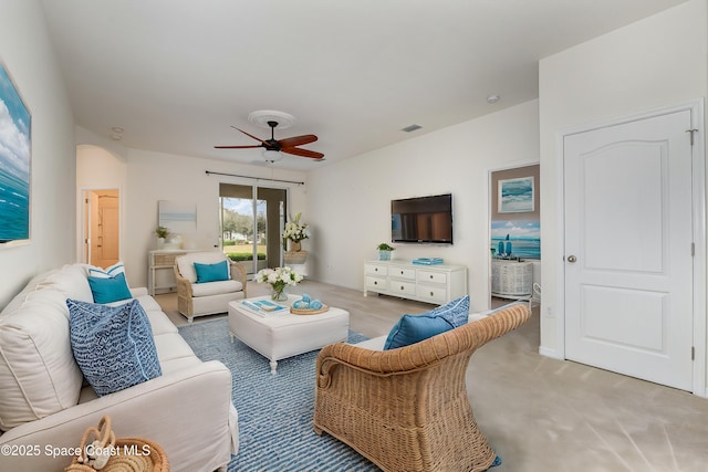 living room featuring ceiling fan and light colored carpet