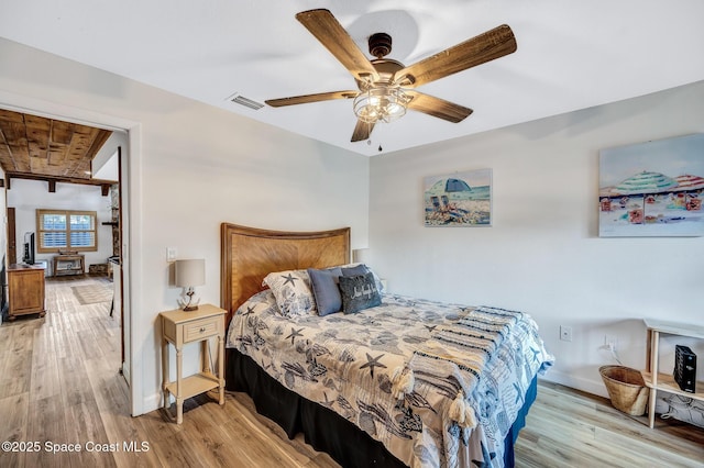 bedroom with ceiling fan, light hardwood / wood-style floors, and wooden ceiling