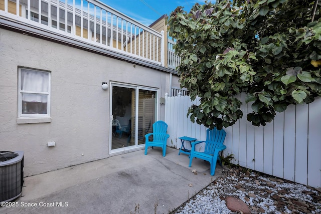 view of patio / terrace with a balcony and central AC unit