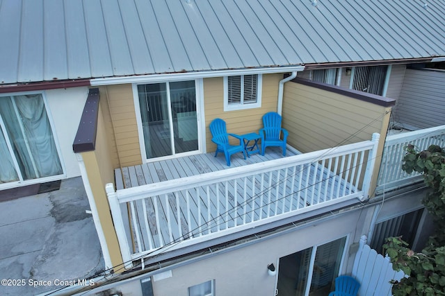 view of side of home with a balcony