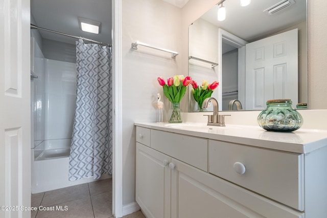 bathroom with shower / tub combo with curtain, vanity, and tile patterned flooring