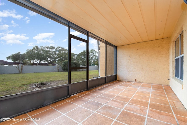 unfurnished sunroom featuring wooden ceiling