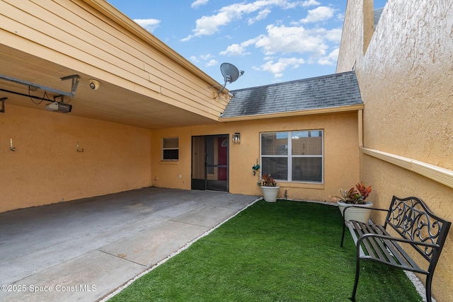 exterior space with a lawn and a patio