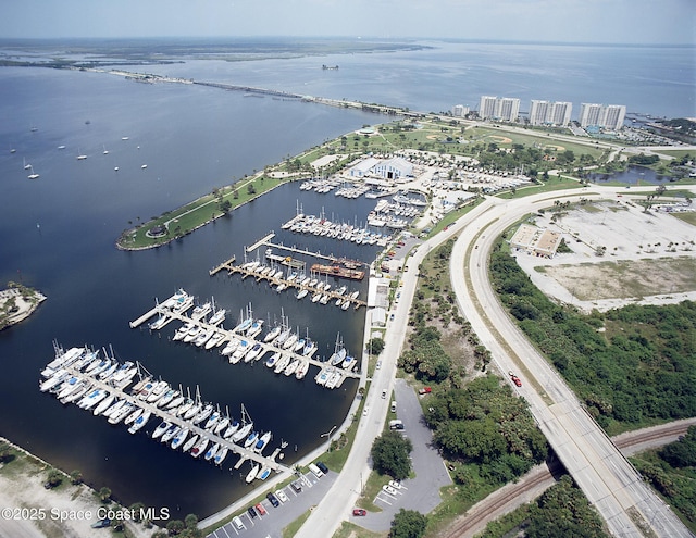 birds eye view of property with a water view