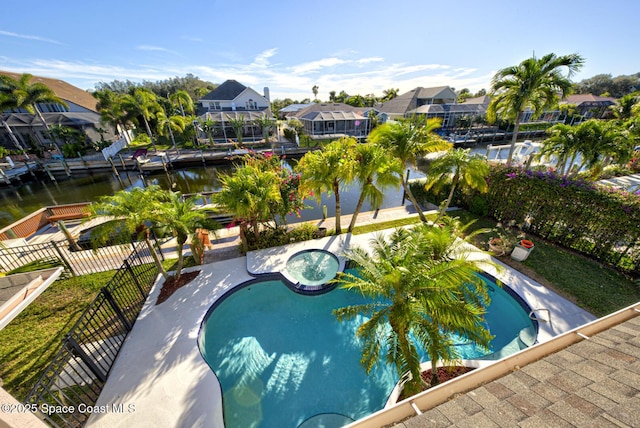 view of pool featuring a community hot tub and a water view