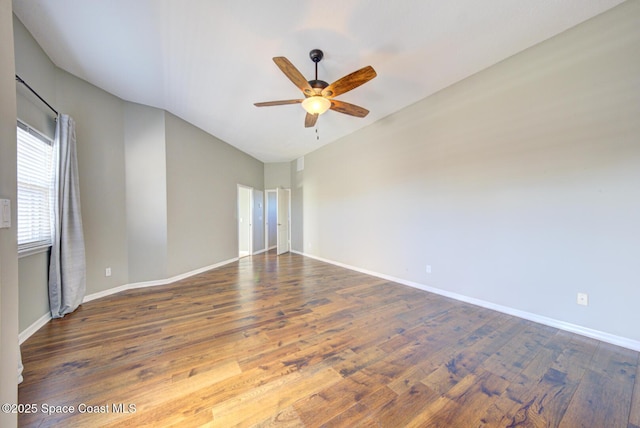 spare room featuring hardwood / wood-style floors and ceiling fan