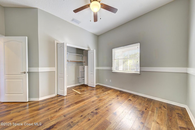 unfurnished bedroom with a closet, ceiling fan, and hardwood / wood-style flooring