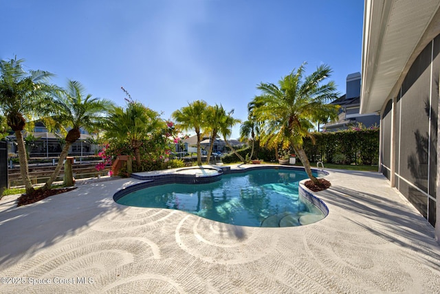 view of swimming pool featuring a patio area