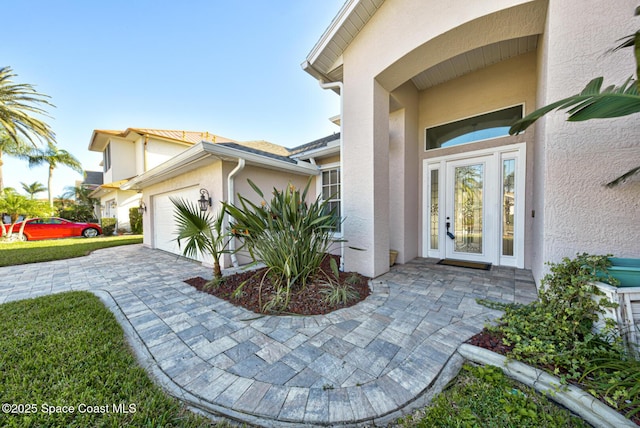 property entrance featuring a garage