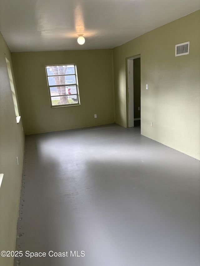 spare room featuring concrete floors