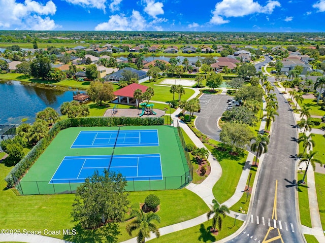 birds eye view of property with a water view