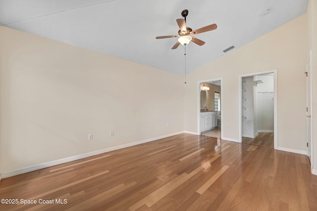 interior space featuring wood-type flooring, lofted ceiling, and ceiling fan