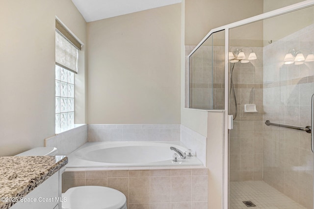 full bathroom featuring toilet, vanity, and shower with separate bathtub