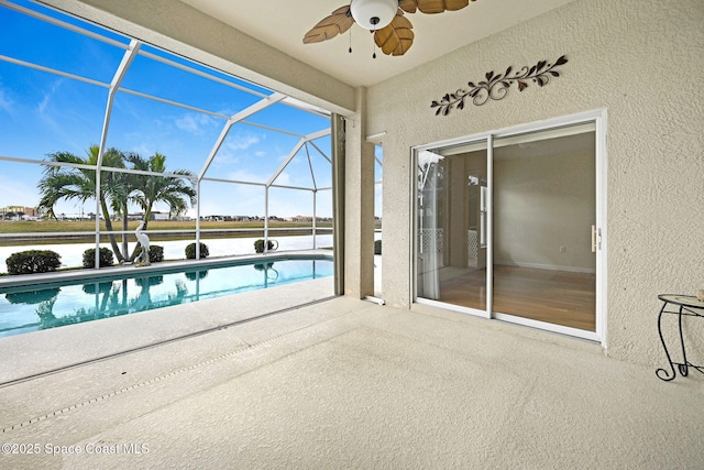 view of pool featuring ceiling fan, a lanai, and a patio