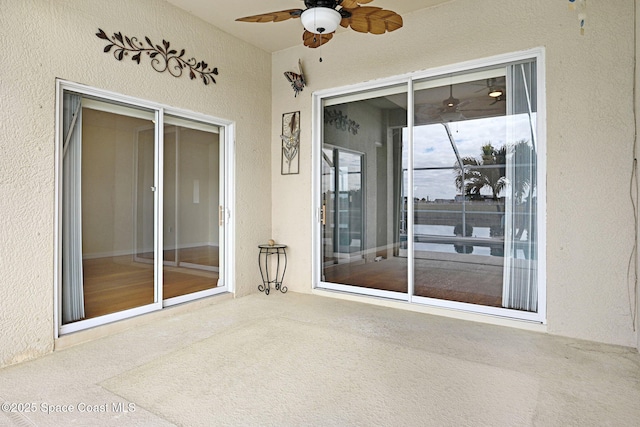 view of patio featuring ceiling fan