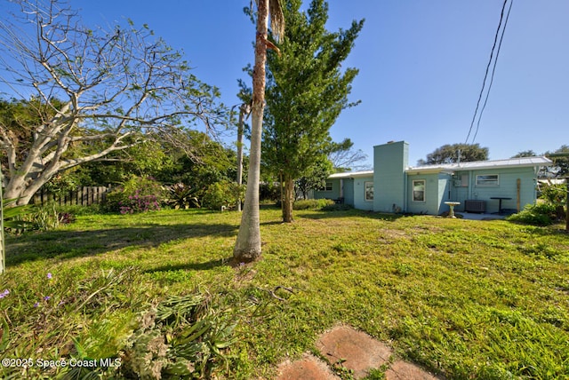 view of yard with central AC