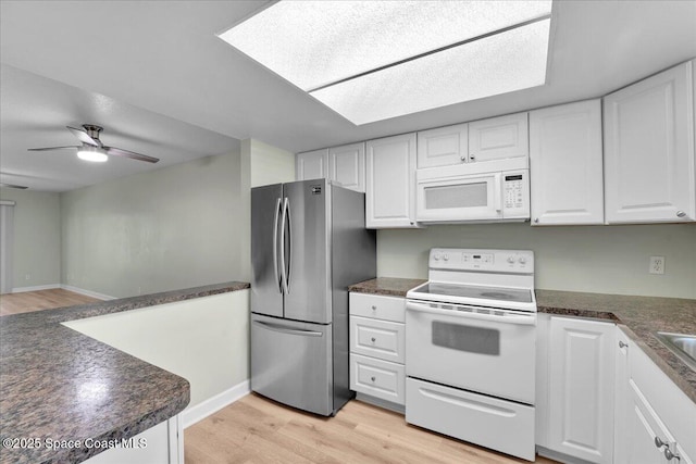 kitchen featuring white cabinetry, ceiling fan, light hardwood / wood-style floors, and white appliances