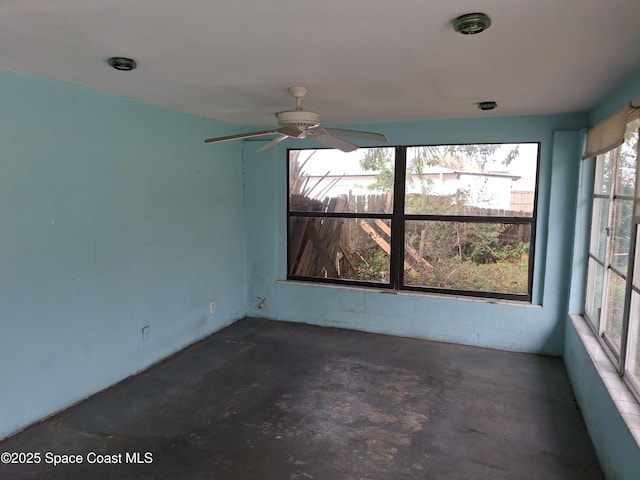 unfurnished room with ceiling fan