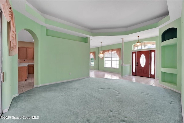 entrance foyer featuring light carpet