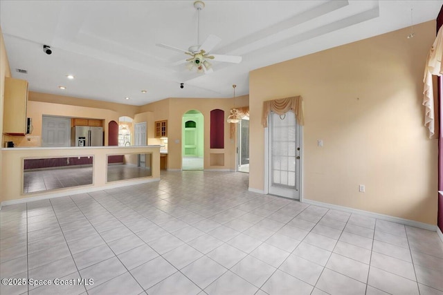 unfurnished living room featuring light tile patterned floors and ceiling fan