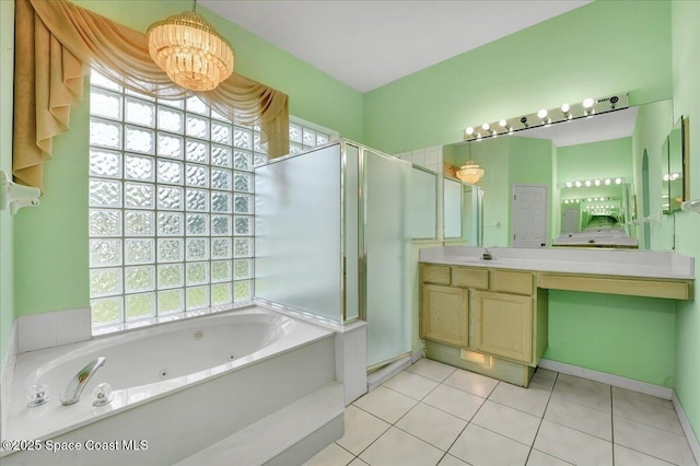 bathroom with plus walk in shower, vanity, tile patterned floors, and a notable chandelier