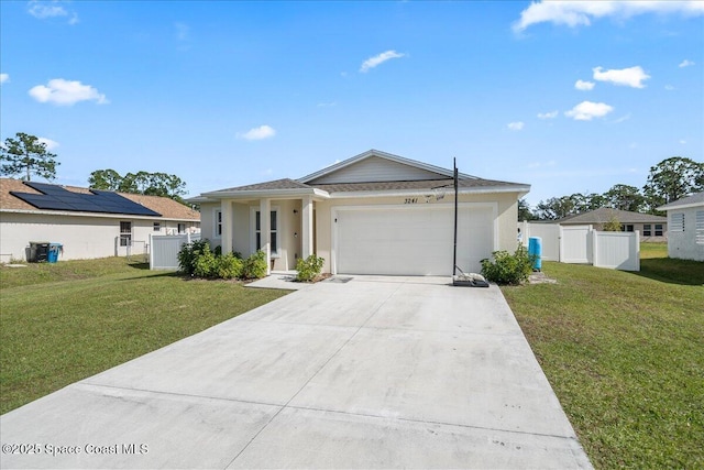 view of front of house featuring a front yard and a garage