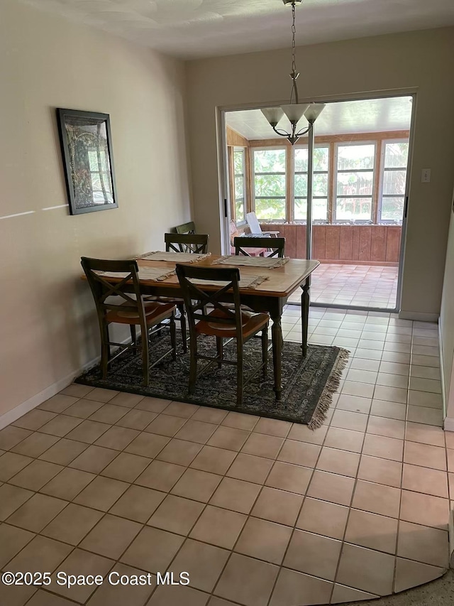 dining area with light tile patterned floors