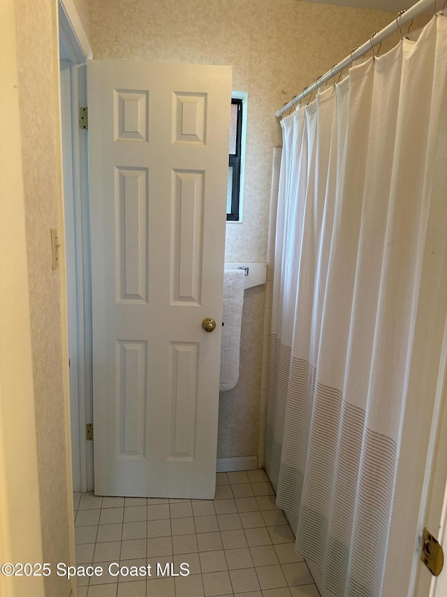 bathroom featuring tile patterned flooring