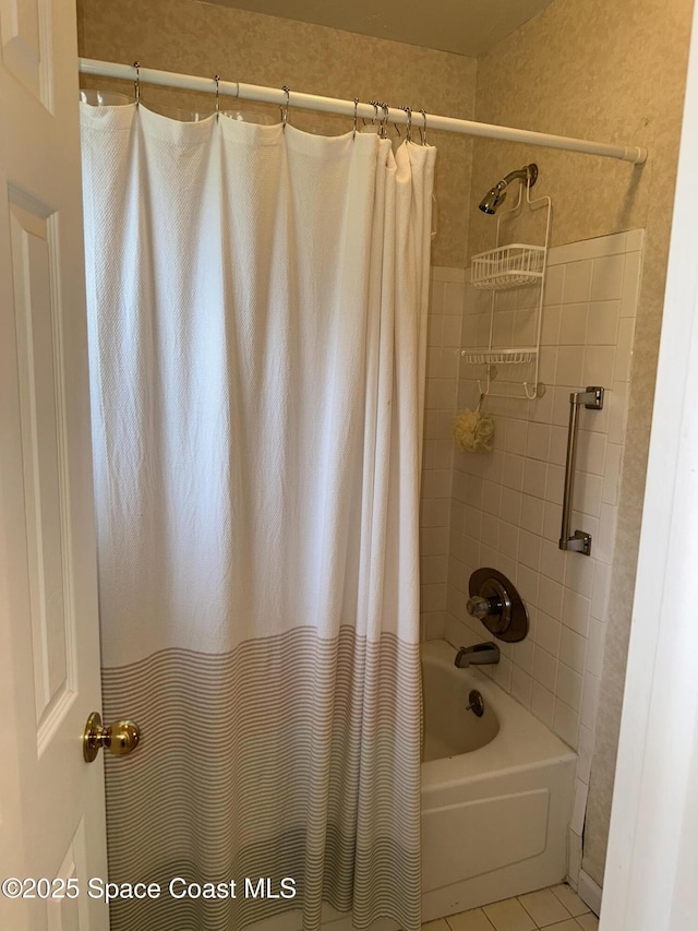 bathroom with tile patterned flooring and shower / bath combo with shower curtain