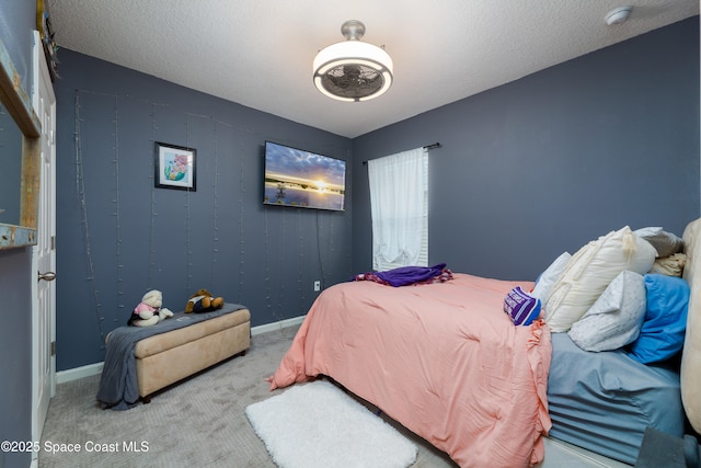 carpeted bedroom with a textured ceiling