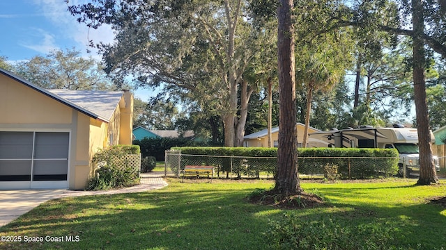 view of yard featuring a garage