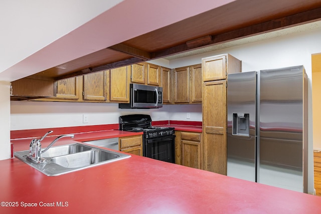 kitchen with sink and appliances with stainless steel finishes