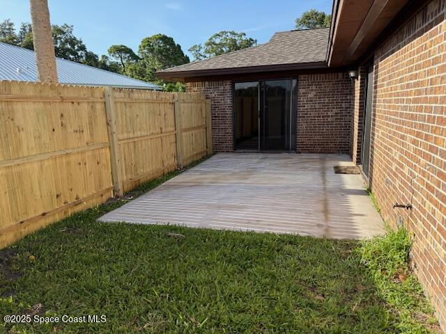 901 Emerson Dr NE, Palm Bay, FL 32907 - wooden deck with a patio