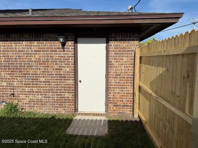 901 Emerson Dr NE, Palm Bay, FL 32907 - doorway to property with brick siding