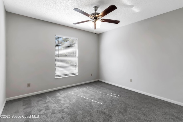 carpeted empty room with ceiling fan and a textured ceiling