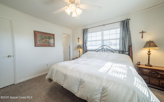 carpeted bedroom featuring ceiling fan and ornamental molding