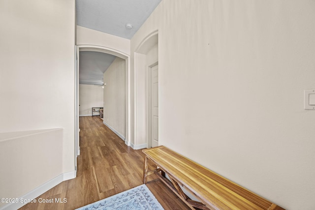 corridor featuring hardwood / wood-style floors