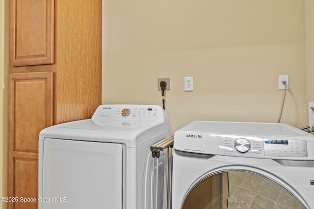 laundry area with washer and dryer