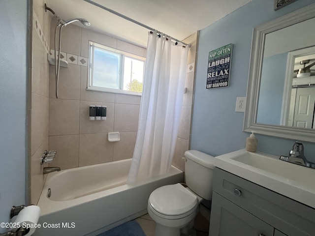 bathroom with vanity, toilet, and shower / tub combo with curtain