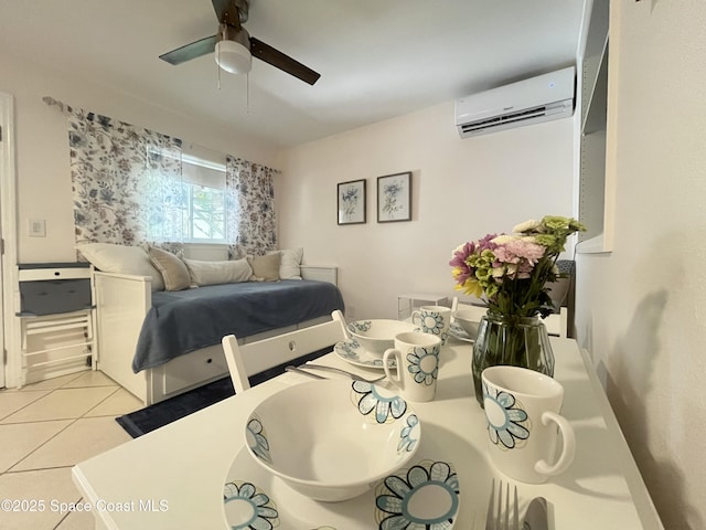 tiled bedroom featuring an AC wall unit and a ceiling fan