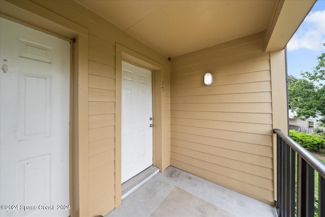 doorway to property featuring a balcony