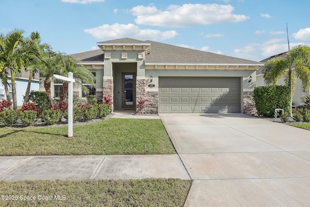 view of front facade with a garage and a front lawn