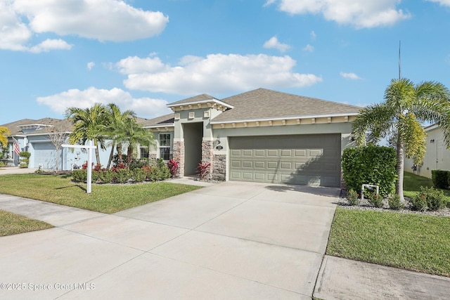 view of front of house featuring a front yard and a garage