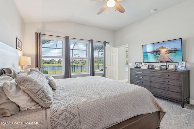 bedroom with ceiling fan, light carpet, and vaulted ceiling