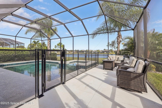 view of swimming pool with a lanai, a jacuzzi, an outdoor hangout area, a patio area, and a water view