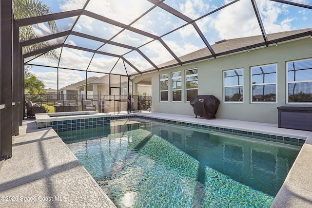 view of pool featuring area for grilling, glass enclosure, and a hot tub