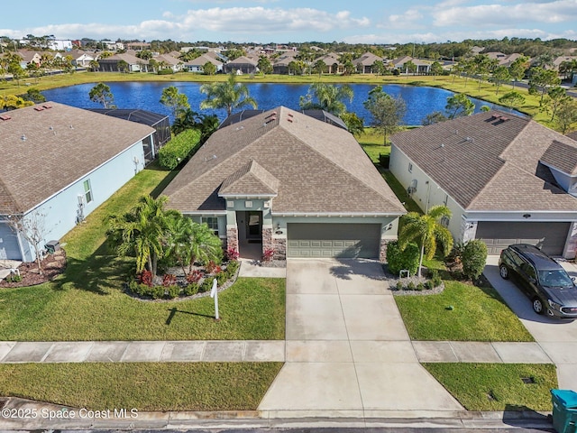 bird's eye view with a water view